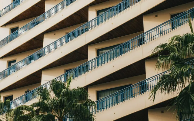 Residential apartment balconies and palm trees in Málaga
